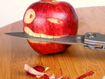 Sfondo: Apple Biting A Knife