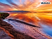 Sunset Over A Beach